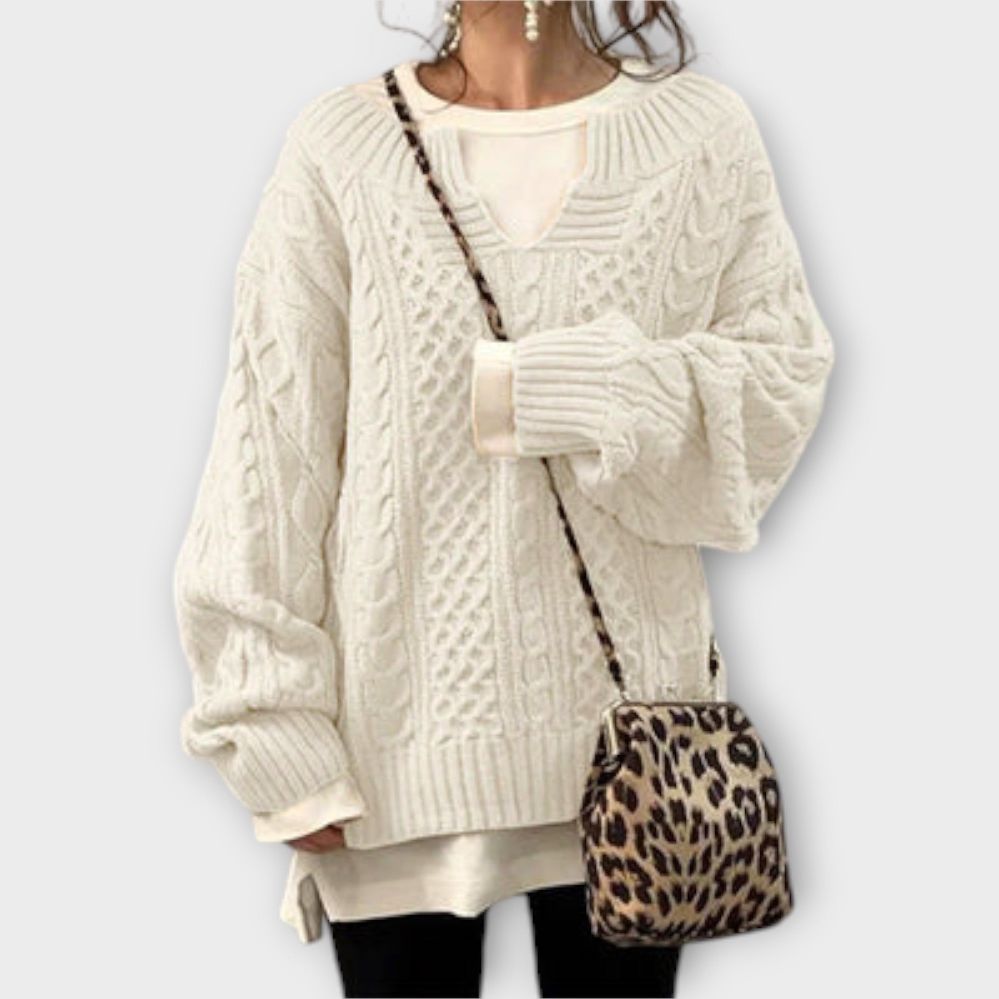 Extra large knitted sweater with braid pattern