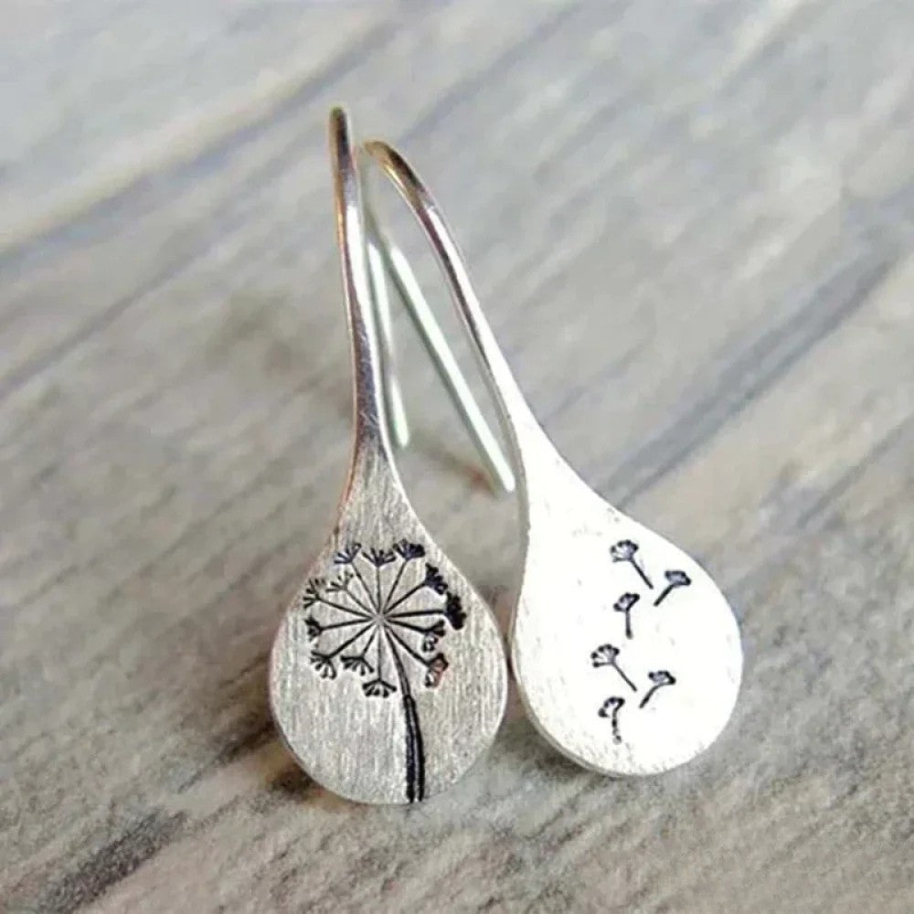 Elegant silver earrings in a dandelion leaf design